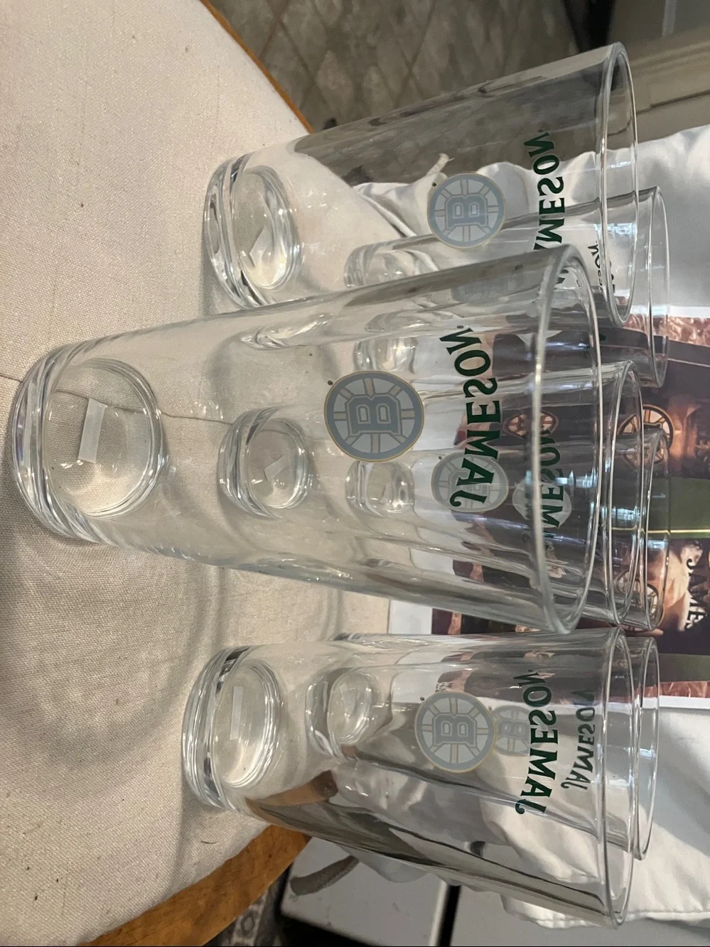 New. Set of 7 pint size glasses with Jameson - Boston Bruins logo on front
